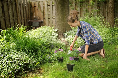 Gardener using equipment safely during maintenance